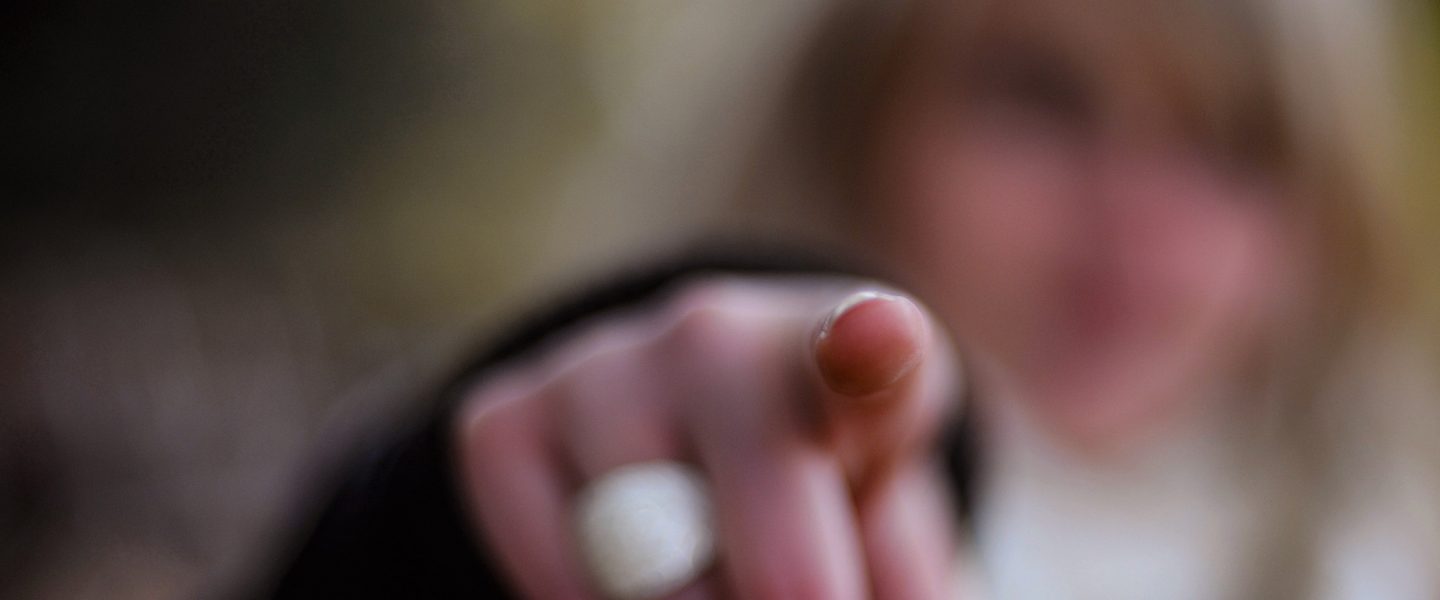 Woman, pointing finger
