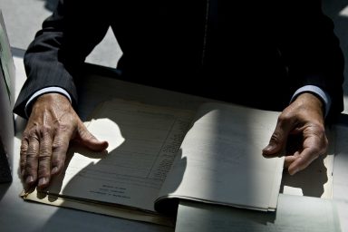 National Archives, staff member, reviews files