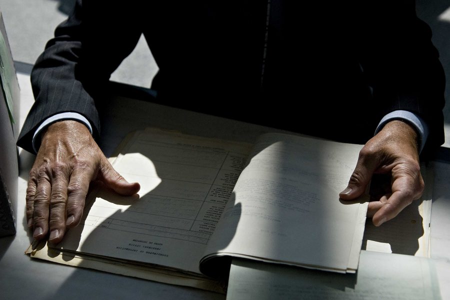 National Archives, staff member, reviews files