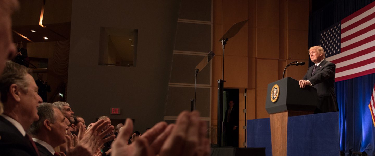 Donald Trump, behind podium