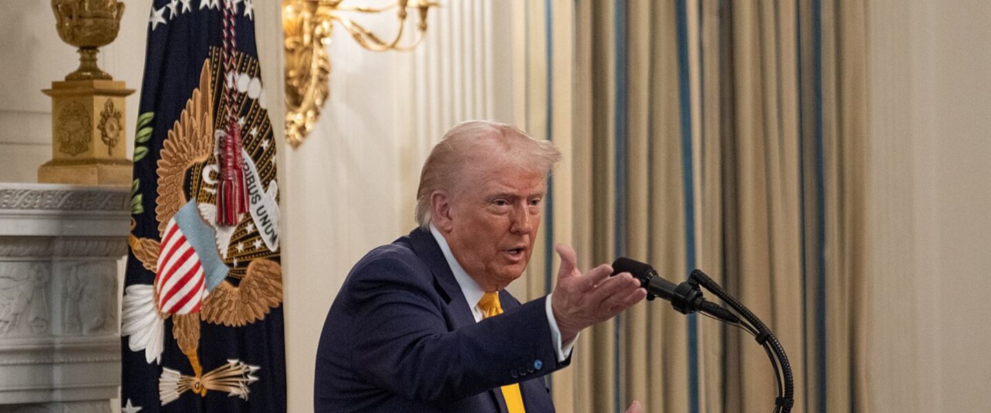 President Donald Trump, speaking, podium