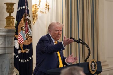 President Donald Trump, speaking, podium